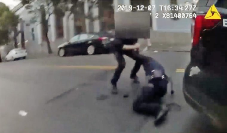 Burglary suspect Jamaica Hampton attacks a police officer with a bottle in this bodycam video on Dec. 7 in San Francisco.