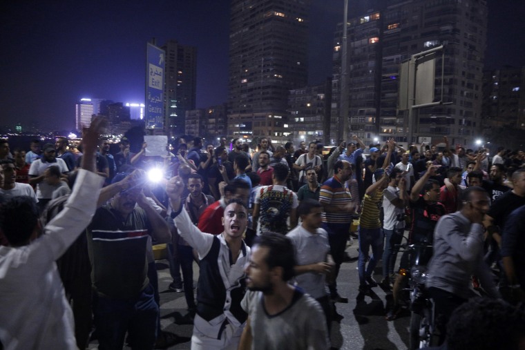 Image: Egyptian protesters shout slogans as they take part in a protest calling for the removal of President Abdel Fattah al-Sisi in Cairo's downtown