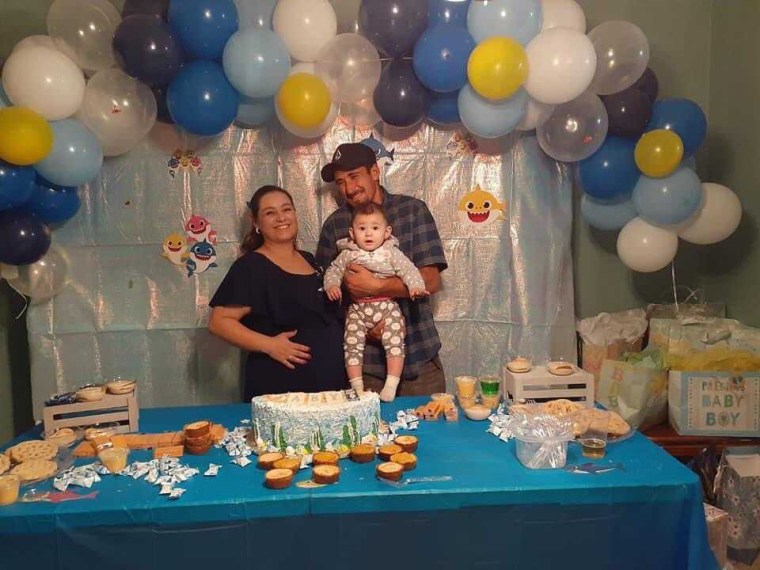 Erika Becerra, seen here with her husband, Diego, and daughter, Erika Guadalupe, had a small baby shower in October ahead of welcoming her son.