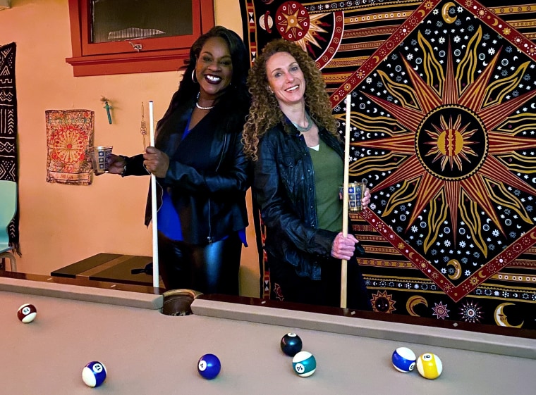 Over a game of pool, state legislator Leslie Herod and lawyer Mari Newman discussed an idea for a change to Colorado law that could help make individual police officers accountable in civil court for misconduct. They removed their masks for this photo.