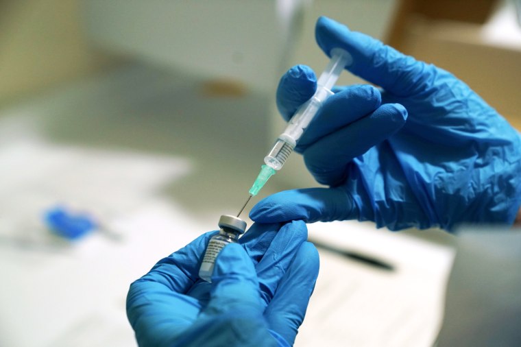 Image: FILE PHOTO: A needle is filled from a phial of Pfizer/BioNTech COVID-19 vaccine at the Royal Victoria Infirmary in Newcastle
