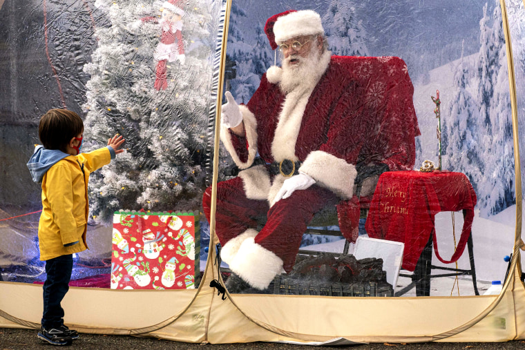 Image: Santa Greets Children From Safety Of Socially-Distanced Bubble