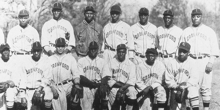 The 1932 Pittsburgh Crawfords in Hot Springs, Arkansas in March. Satchel Paige is in the back row, second from left, Josh Gibson is to the right of Paige, and Oscar Charleston, is far right.