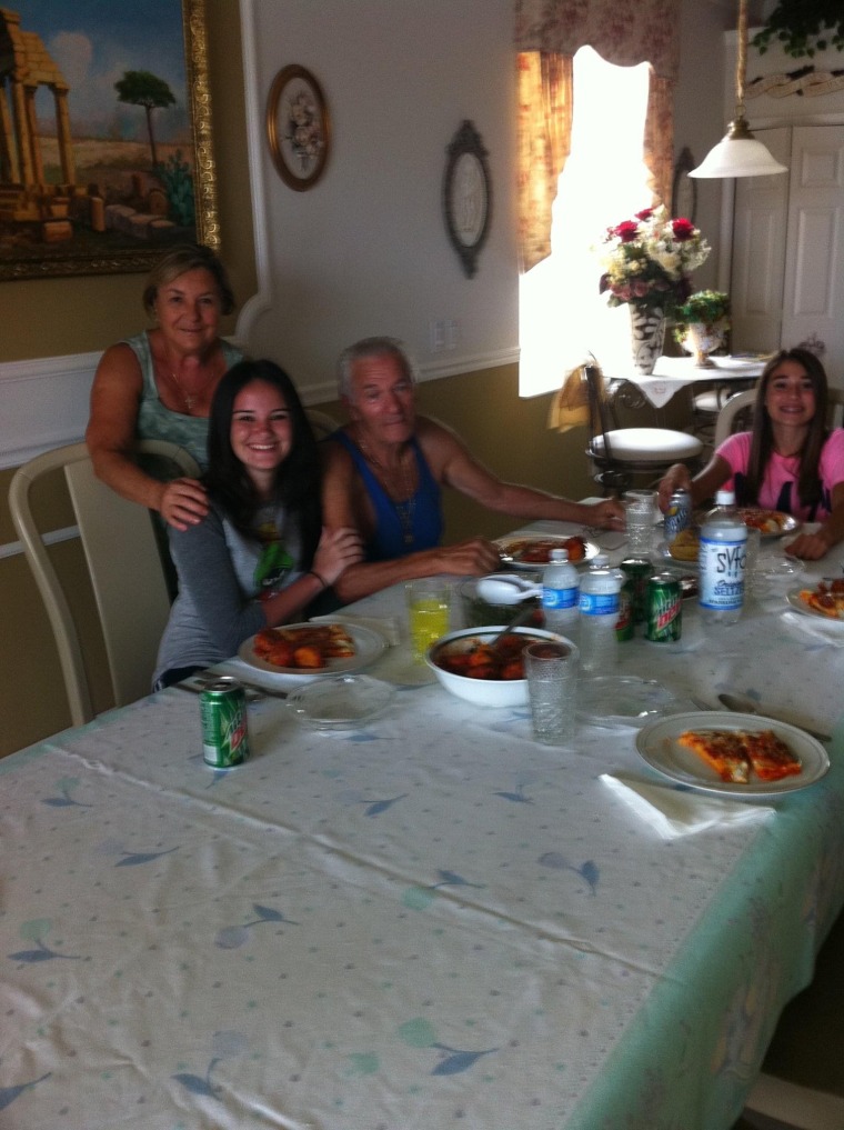 Molina with Nonna and Nonno and her younger sister, Francesca, enjoying manicotti.