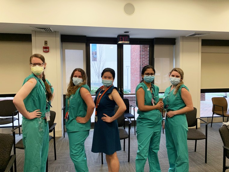 Rachel Friedman, a pediatric resident at Westchester Medical Center, poses with her colleagues after getting vaccinated.