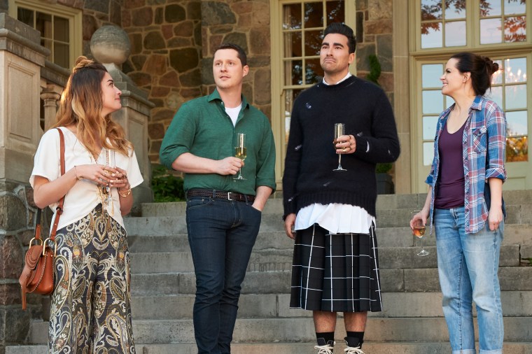 Alexis played by Annie Murphy, Patrick played by Noah Reid, David played by Dan Levy, and Stevie played by Emily Hampshire in "Schitt's Creek" Season 5.