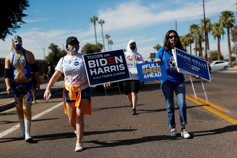Image: People promote the importance of the Latino vote in Maryvale, Phoenix