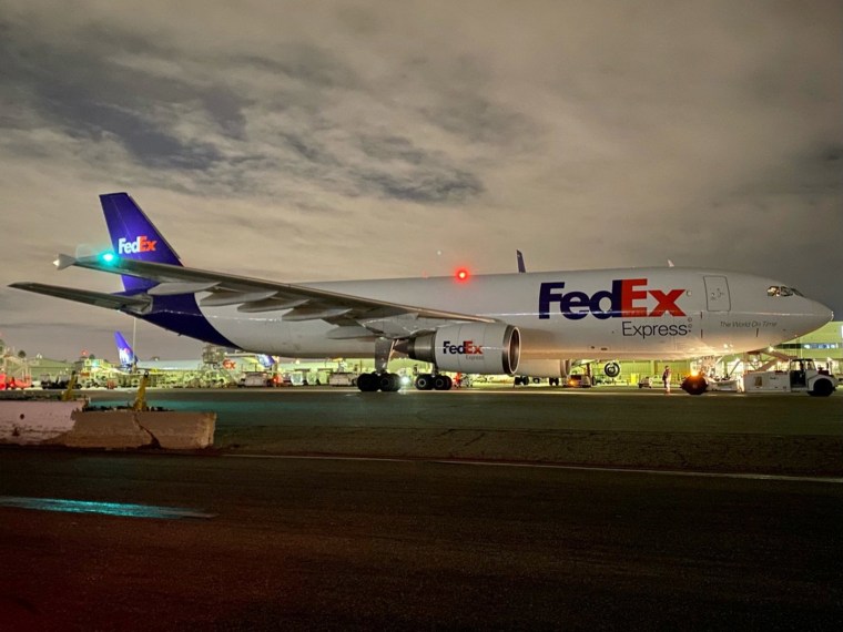 Image: A plane of FedEx Express carrying a first batch of Pfizer/BioNTEch COVID-19 vaccine is seen at LAX Airport, following the outbreak of the coronavirus disease (COVID-19), in Los Angeles