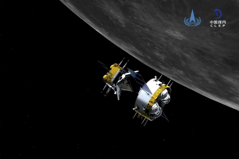 This graphic simulation image shows the orbiter and returner combination of China's Chang'e-5 probe after its separation from the ascender, at the Beijing Aerospace Control Center (BACC) in Beijing on Dec. 6, 2020.