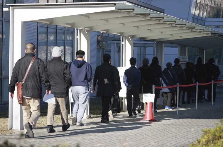 People line to get tickets to watch a lay judge trial over the alleged murders of nine people in Zama, Kanagawa Prefecture, at Tachikawa Court in Tachikawa, Tokyo on Dec. 15, 2020.