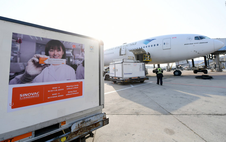 Image: A container containing experimental coronavirus vaccines made by Chinese company Sinovac waits to be loaded onto a Garuda Indonesia plane at the Beijing International Airport in Beijing earlier this month.