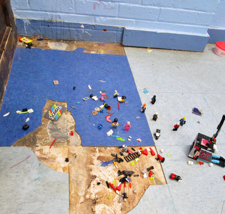 Toys litter a dirty floor and broken tiles at Sequel's Courtland facility.