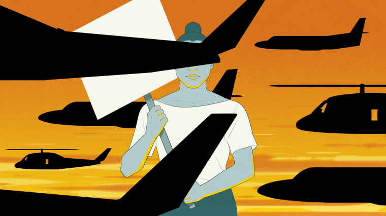 Image: A protester holding a sign is blocked by spy planes and spy helicopters against a sunset.