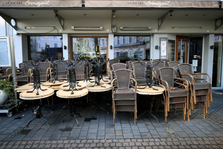 Image: Chairs and table are seen outside a restaurant on the first day of a nationwide lockdown due to the coronavirus disease (COVID-19) outbreak, in Bonn, Germany
