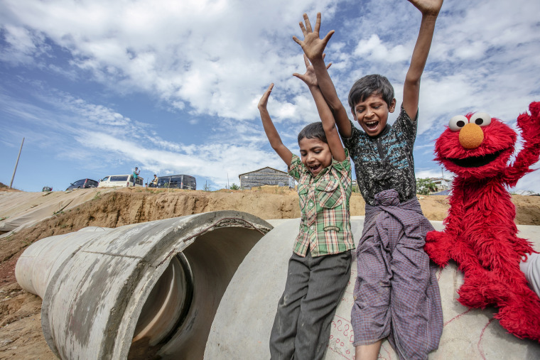 Elmo plays with Rohingya children in the Kutapalong camp in Cox's Bazar, Bangladesh.
