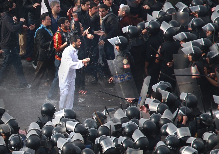 Image: Riot police face protestors on the Kasr Al Nile Bridge on Jan. 28, 2011 in downtown Cairo, Egypt