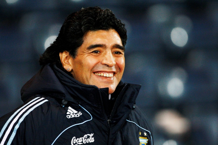 Image: FILE PHOTO: Argentina's soccer team head coach Maradona smiles during their international friendly soccer match against Scotland in Glasgow, Scotland