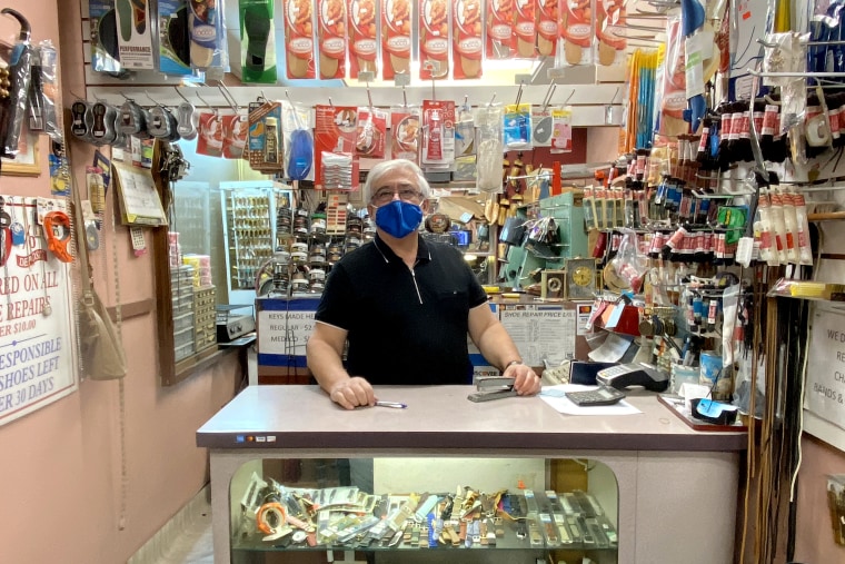 David Yushubayev, 67, stands at the counter of Markell's Shoe Repair in Midtown Manhattan, where business is "dead," he says.
