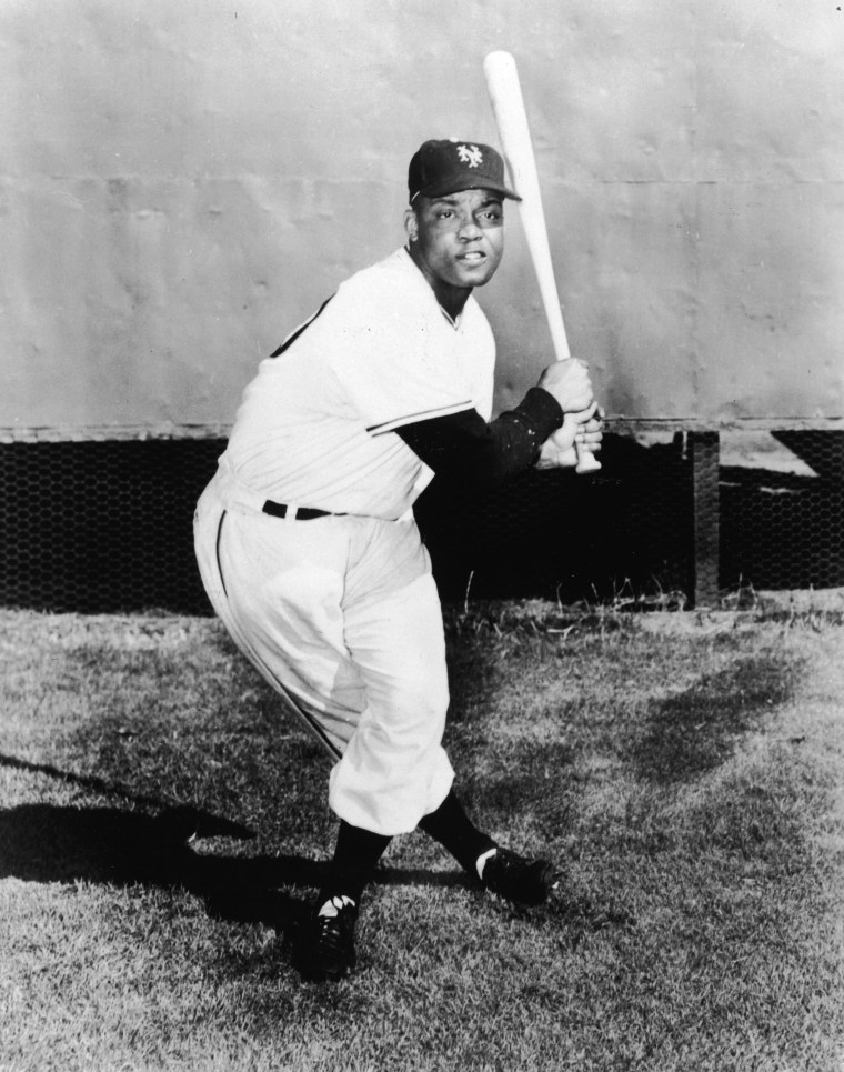 Monte Irvin holding baseball bat