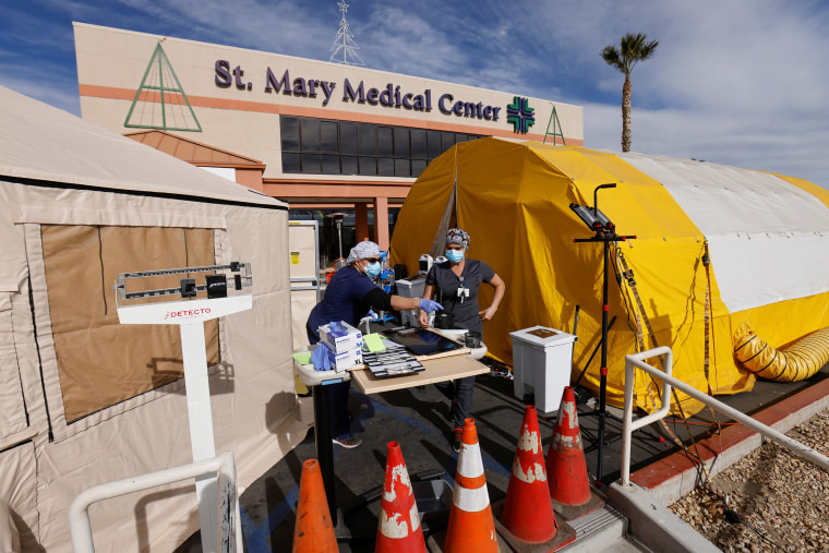 Image: Hospitals resort to triage tents outside to deal with the overflow during the outbreak of the coronavirus disease in California