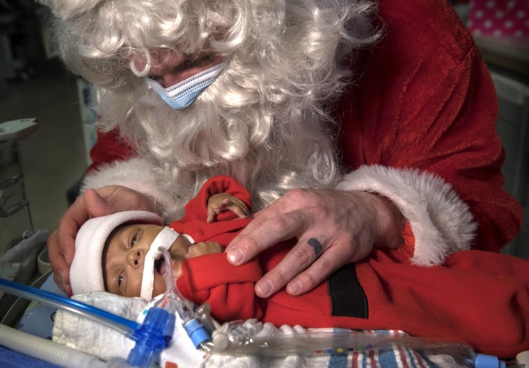 See photos of Santa visiting with tiny babies in a NICU