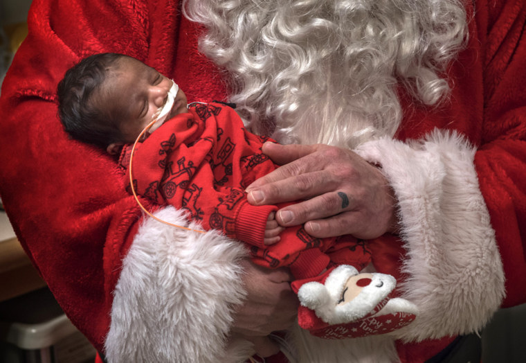 NICU nurse Jason Yakes dressed up as Santa Claus. 