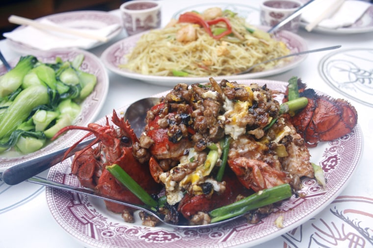 Young calls Hop Lee's lobster Cantonese dish — shown in the foreground here with stir-fried baby bok choy and Singapore chow mai fun in the background — "outrageously delicious."
