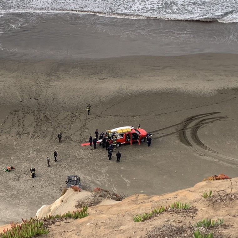 A woman was rescued on Christmas Day after her car went off a cliff at a beach in San Francisco.
