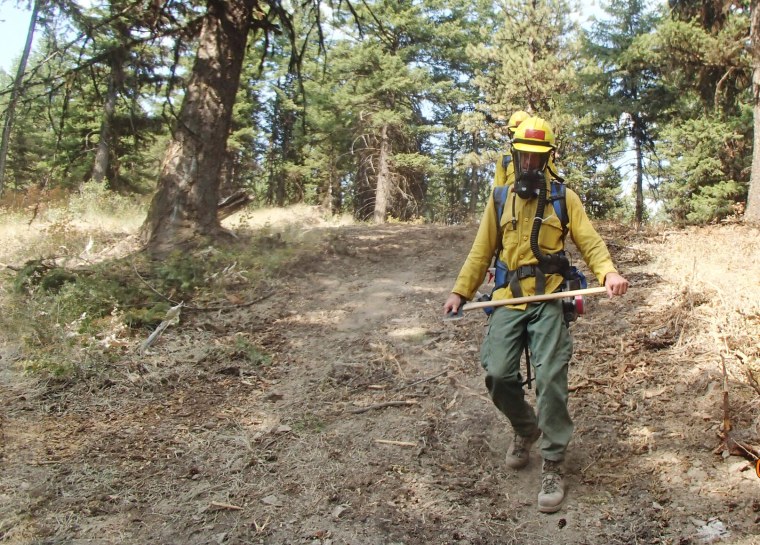 Firefighters wearing respirators in the OU3 area in Montana.