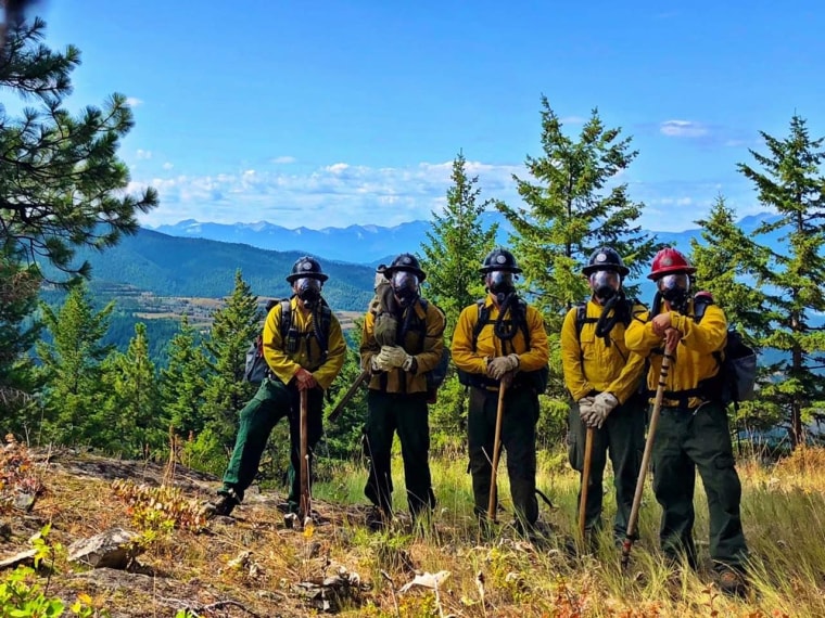 Nolan Buckingham, in red hat, stands with his crew on a spot overlooking the heart of the mine in August 2019.