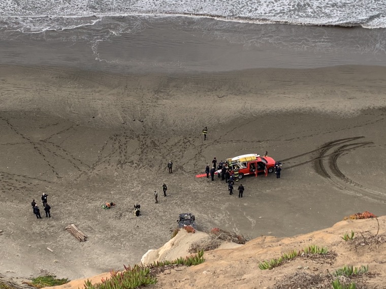 A woman was rescued on Christmas Day after her car went off a cliff at a beach in San Francisco.