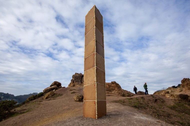 A gingerbread monolith stands on Christmas Day on a bluff in Corona Heights Park overlooking San Francisco. 
