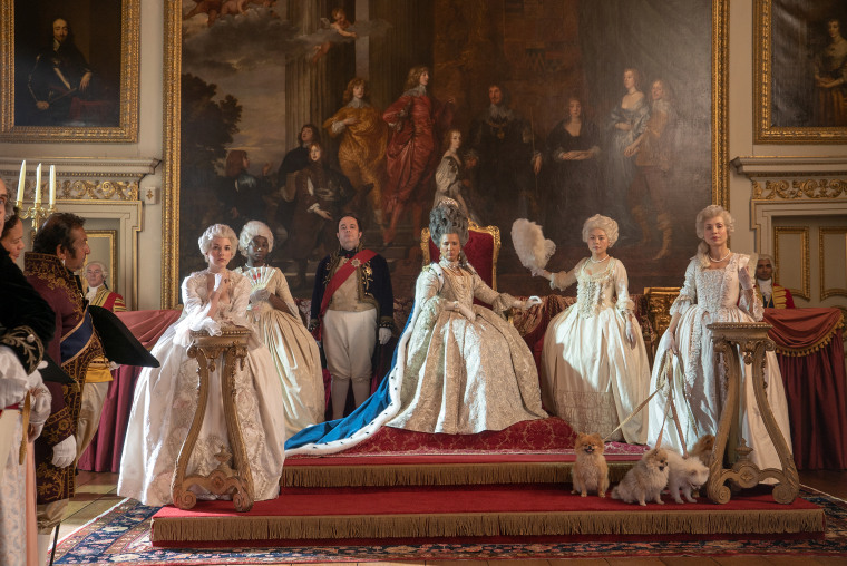 Queen Charlotte (Golda Roshueval) dons some elaborate wigs and glamorous gowns throughout the series. 