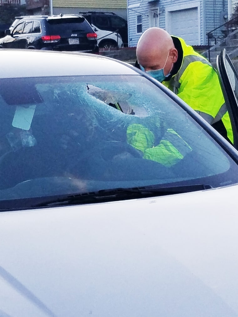 A car's windshield was damaged by a brick in Worcester, Mass., on Dec. 26, 2020.