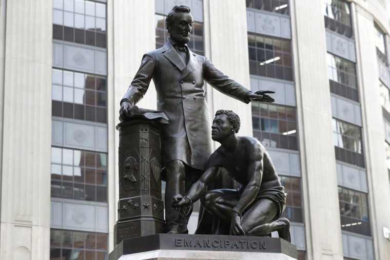 A statue depicts a freed slave kneeling at President Abraham Lincoln's feet in Boston on June 25, 2020. On Dec. 29, the statue was removed from its perch.
