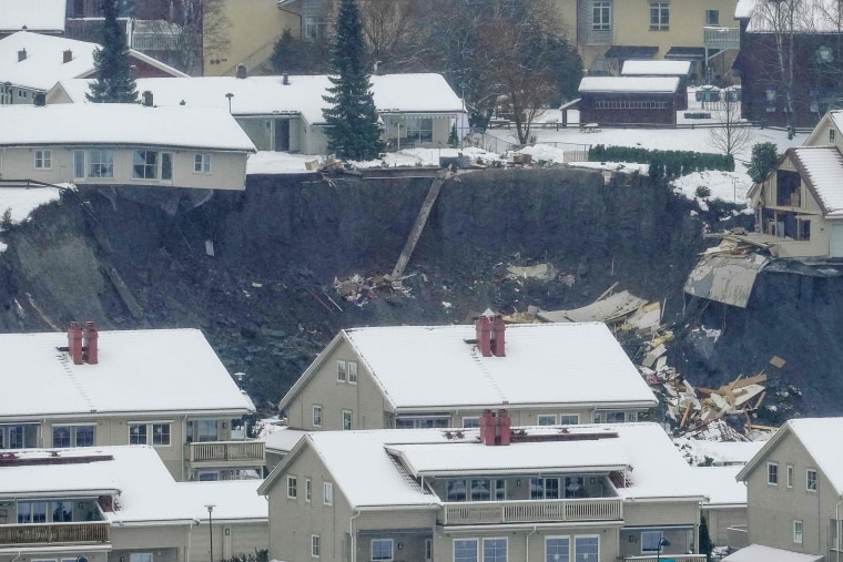 Image: Destroyed houses are seen in a crater left behind by a landslide in the town of Ask, Gjerdrum county, some 40 km northeast of the capital Oslo,