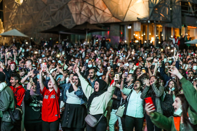 Image: People celebrate as they bring in the New Year at Federation Square during New Year's Eve celebrations