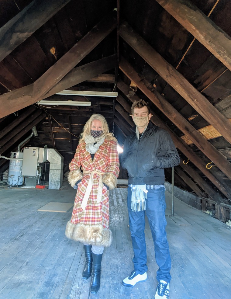 Couple standing inside a house