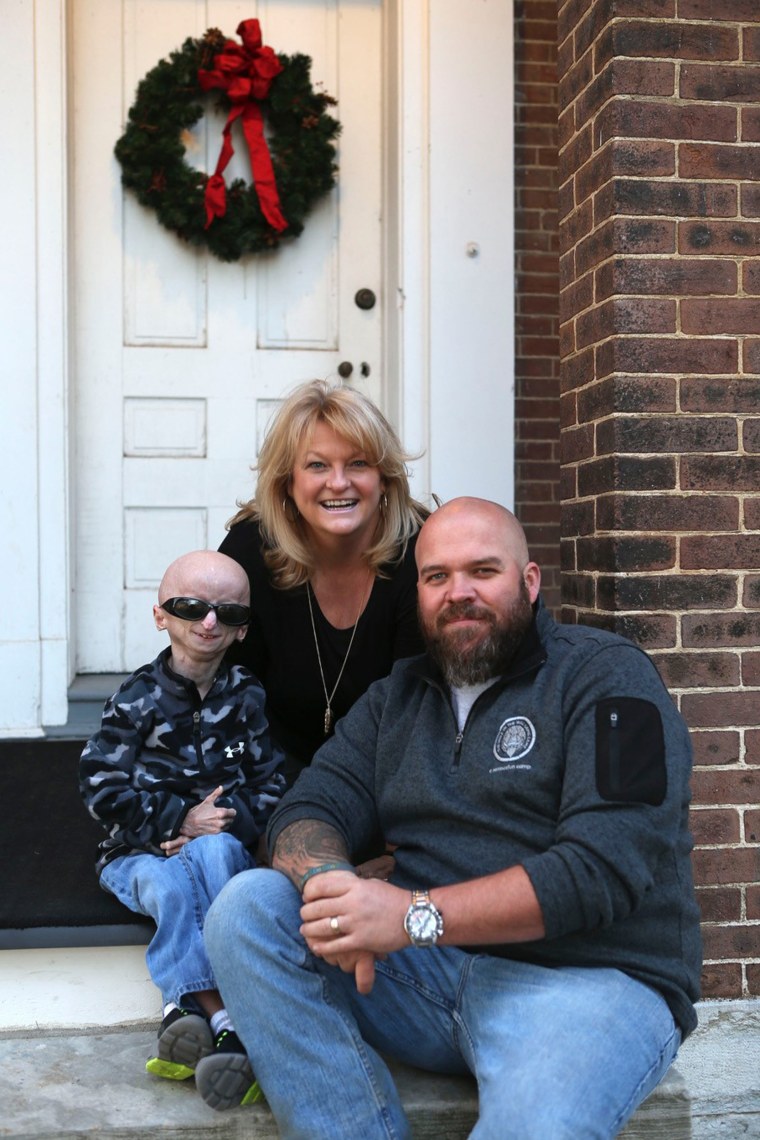 Zach Pickard is pictured with his mom, Tina Pickard, and his dad, Brandon Pickard. Zach has been taking a drug for a decade as part of a clinical trail to treat progeria.
