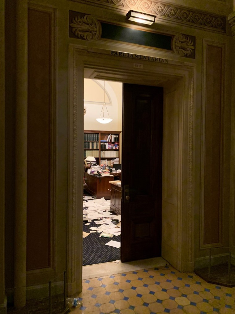 Image: Documents lie on the floor inside the U.S. Capitol in Washington