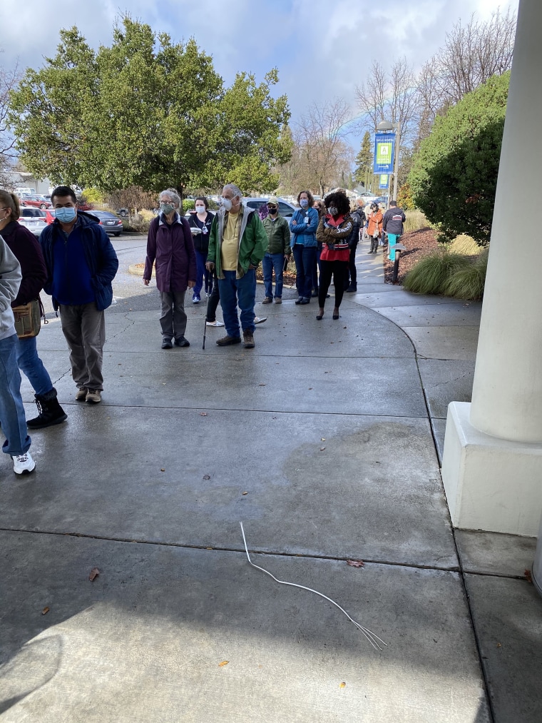 A line forms at one of the COVID-19 vaccine pop-up clinics set up by Adventist Health Ukiah Valley Medical Center in Mendocino County, California, on Jan. 4. Hundreds of members of the general public received Moderna's COVID-19 vaccine after a freezer at the hospital broke and 830 doses almost expired.