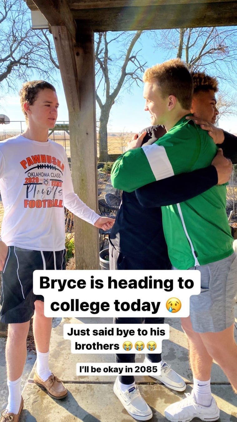 Bryce Drummond hugs his brothers, Todd and Jamar, before leaving for college.