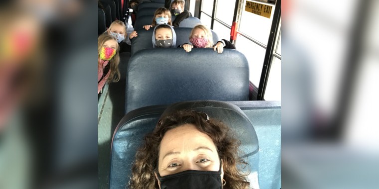 Janet Throgmorton, principal at Fancy Farm Elementary School in Western Kentucky, driving her students home from school.