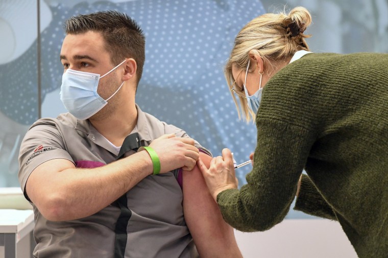 Image: A healthcare worker receives the Pfizer-BioNTech coronavirus vaccine at a mass vaccination center in Veghel, Netherlands on Wednesday.