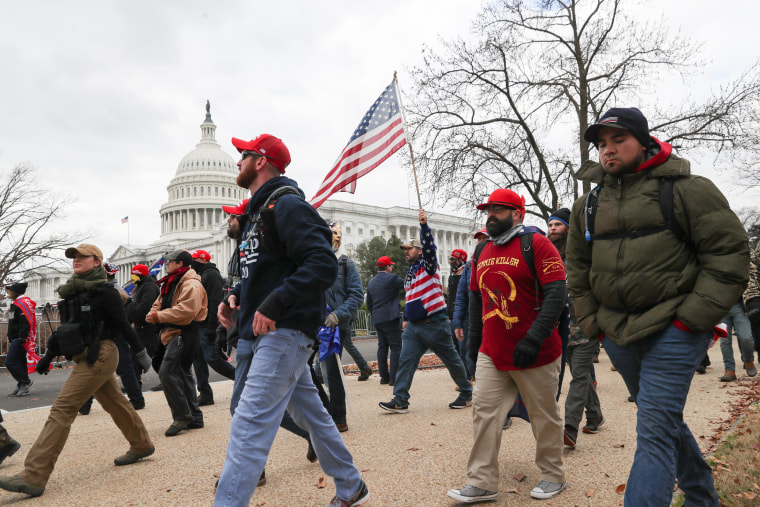 Image: Members of the the far-right group Proud Boys march to the U.S. Capitol Building in Washington