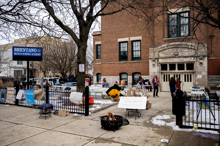 A fire continues to burn as teachers teach virtual classes during a protest against returning to in-person teaching outside of Brentano Elementary School in Chicago on Jan. 4, 2021.