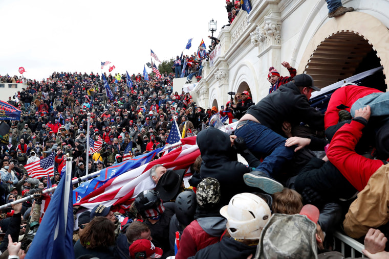 Image: Pro-Trump protesters storm into the U.S. Capitol during clashes with police, during a rally to contest the certification of the 2020 U.S. presidential election results.