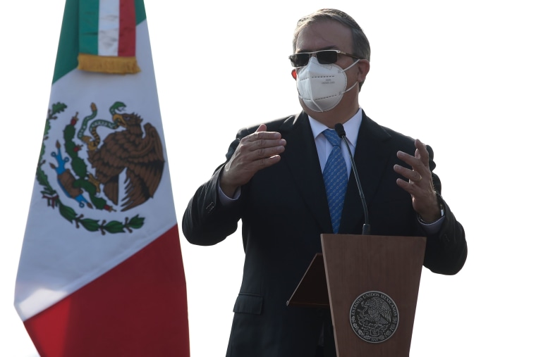 Image: Mexican Foreign Minister Marcelo Ebrard speaks during a ceremony to mark the arrival of doses of the first batch of Pfizer vaccines, Benito Juarez International Airport in Mexico City