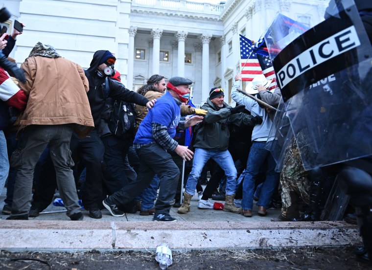 Trump supporters clash with police as they storm the U.S. Capitol on Jan. 6, 2021.