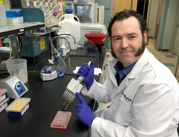Brian O'Roak, a human geneticist, works on coronavirus genetic sequencing at Oregon Health &amp; Science University.